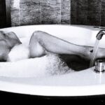 Blonde dutch model posing in jazz in hotel room